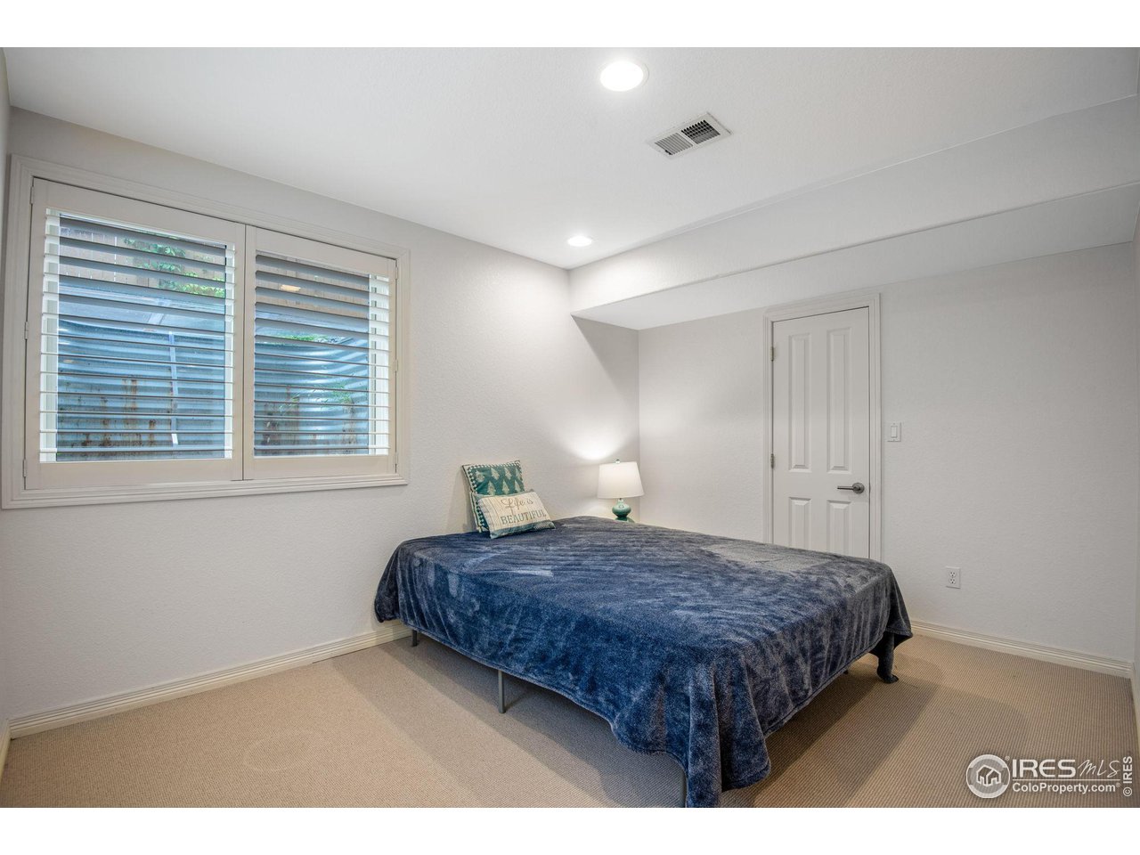 4026 Nevis Street Boulder, CO 80301 - Photo 35 of 40 a bedroom with a bed and a window