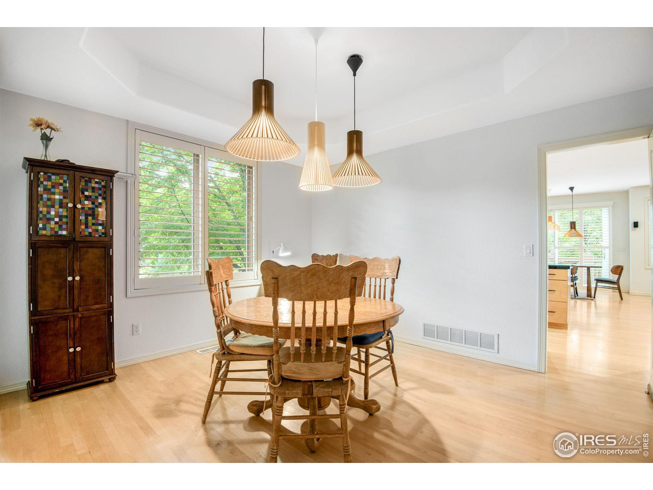 4026 Nevis Street Boulder, CO 80301 - Photo 8 of 40 a dining room with furniture a chandelier and wooden floor