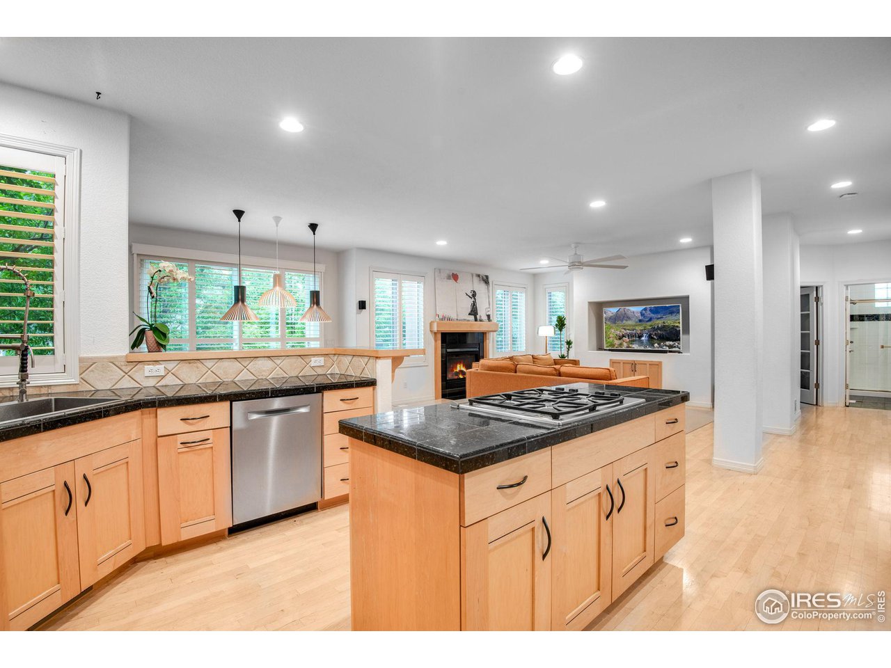 4026 Nevis Street Boulder, CO 80301 - Photo 9 of 40 a kitchen with stainless steel appliances granite countertop a stove a sink and a refrigerator