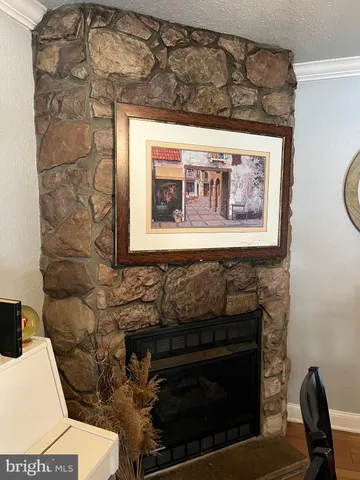 a view of a dining room with furniture and a chandelier