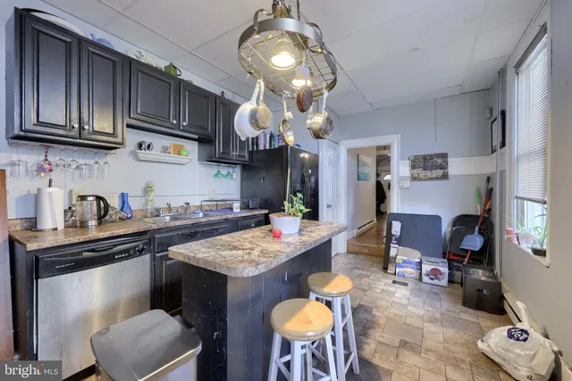 a kitchen with a cabinets and appliances