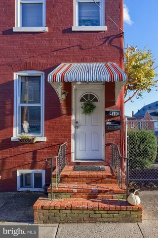 a view of entryway front of house with stairs