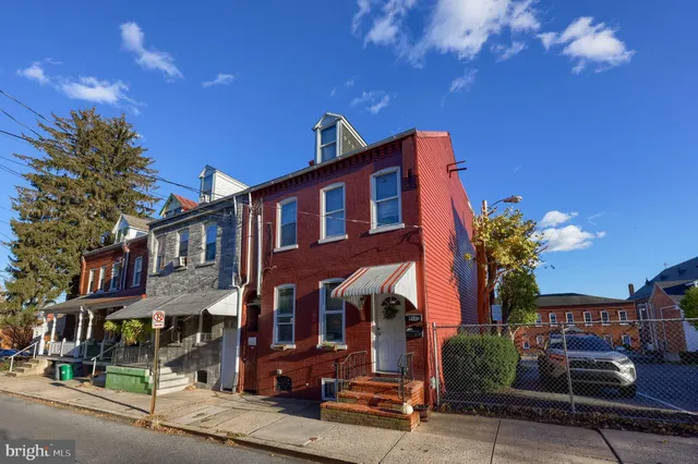 a view of a livingroom with furniture and a window