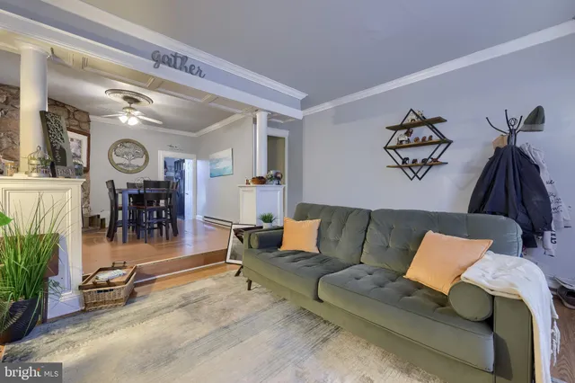 a living room with furniture and a clock