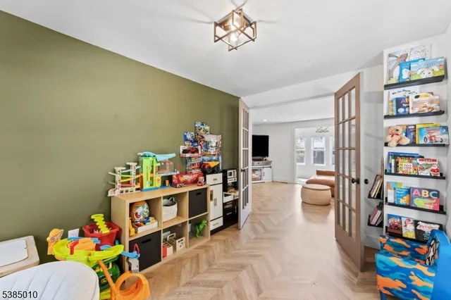 a view of a livingroom with furniture and stairs