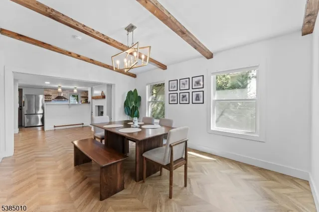 a kitchen with a refrigerator and a stove top oven