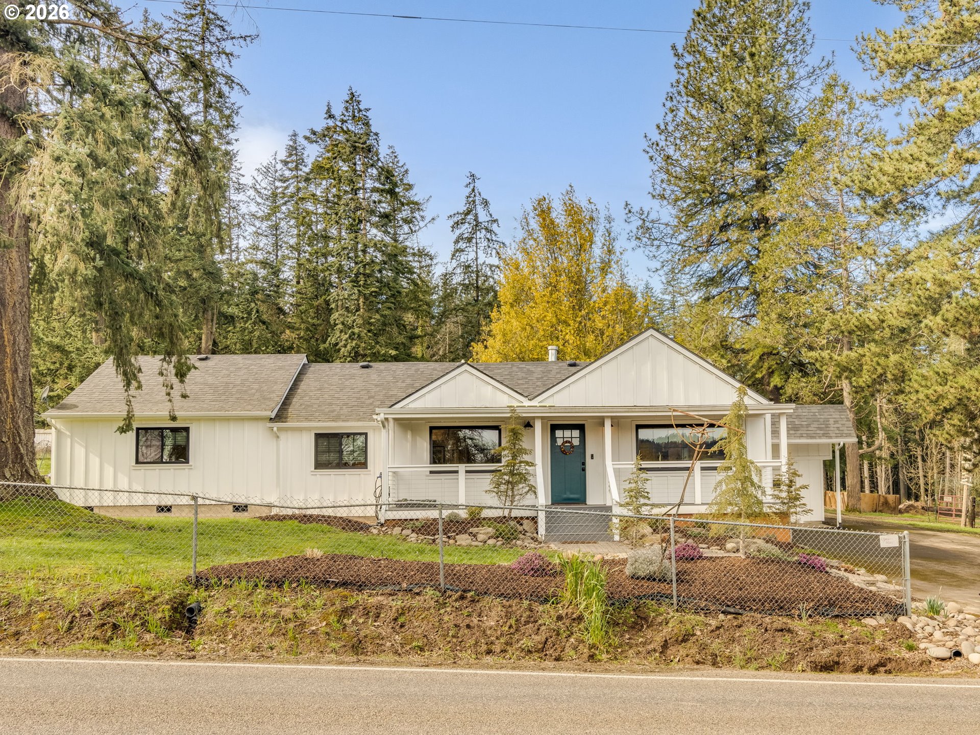 5801 Northeast Abbey Road Carlton, OR 97111 - Photo 1 of 48 a front view of a house with garden