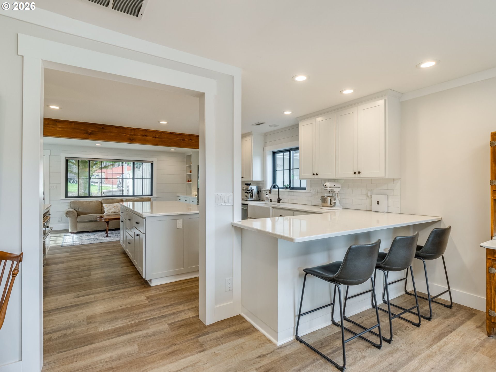 5801 Northeast Abbey Road Carlton, OR 97111 - Photo 13 of 48 a large white kitchen with a table and chairs