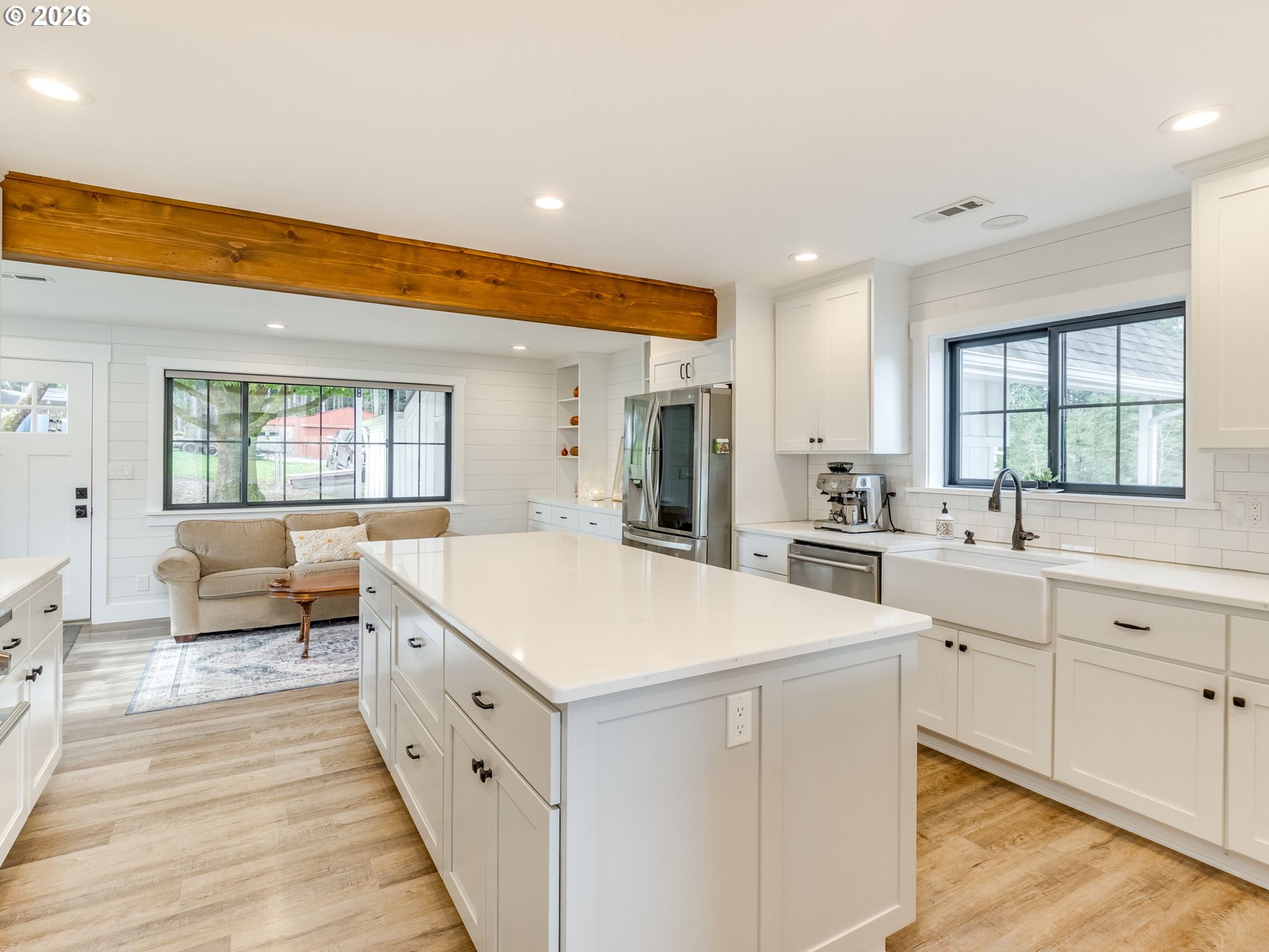 5801 Northeast Abbey Road Carlton, OR 97111 - Photo 14 of 48 a large white kitchen with a sink and cabinets
