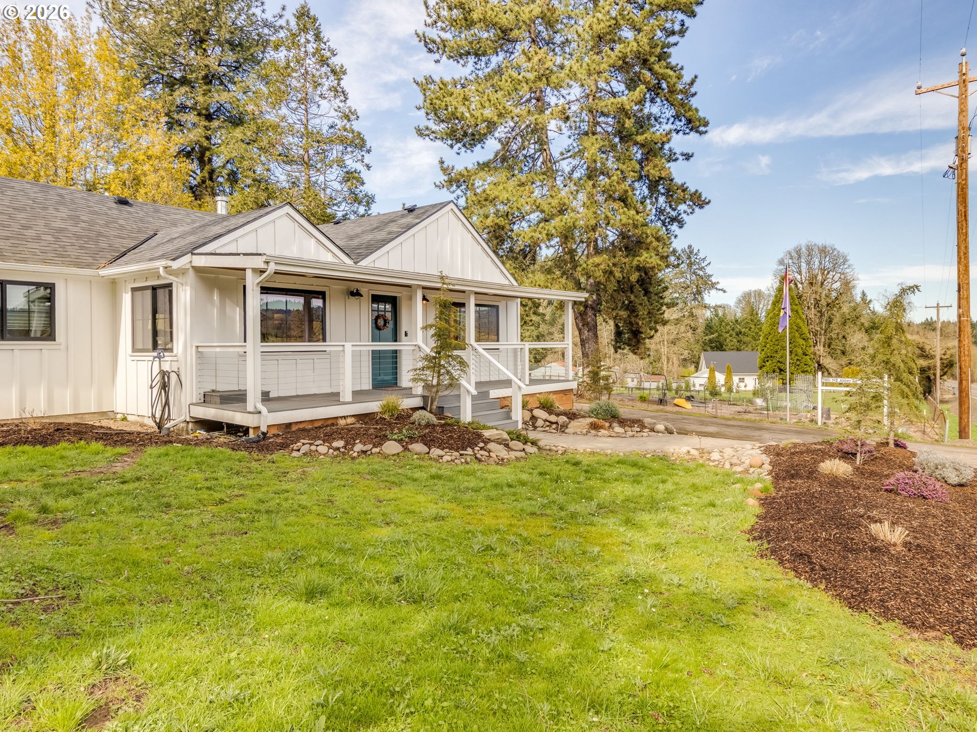 5801 Northeast Abbey Road Carlton, OR 97111 - Photo 3 of 48 a front view of a house with swimming pool having outdoor seating