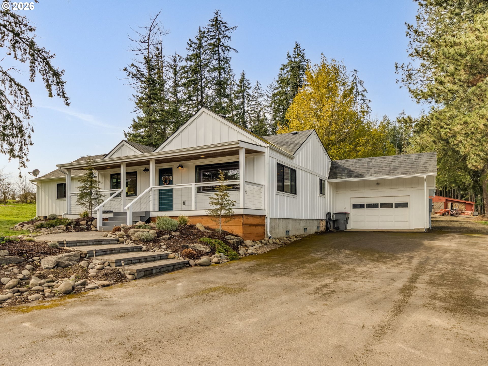 5801 Northeast Abbey Road Carlton, OR 97111 - Photo 47 of 48 a view of a white house with a large tree in front of it