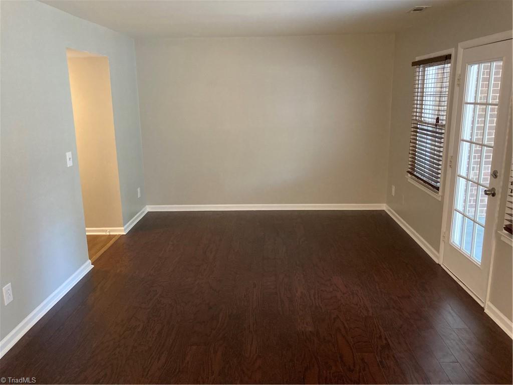 2930 St Marks Road Southwest, Unit E Winston-Salem, NC 27103 - Photo 17 of 49 Back inside, see the left wall of the living room, with access (on the left of the photo) to the first floor's hall.