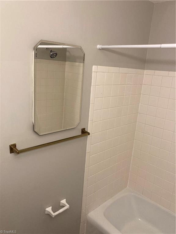 2930 St Marks Road Southwest, Unit E Winston-Salem, NC 27103 - Photo 38 of 49 Shared bath's mirror opens to reveal a medicine cabinet.