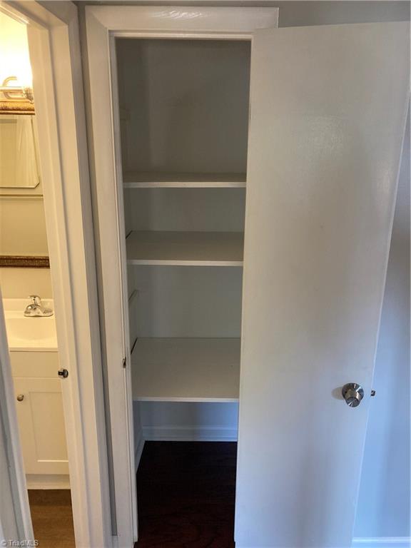 2930 St Marks Road Southwest, Unit E Winston-Salem, NC 27103 - Photo 39 of 49 Between shared bath and primary suite is this linen closet, accessible to all on the 2nd floor.