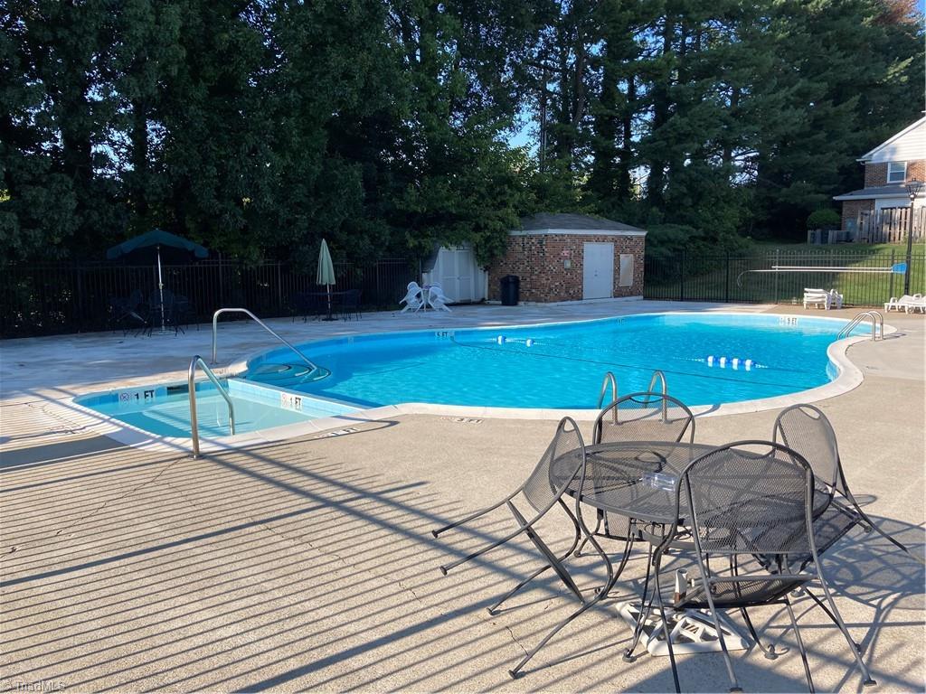 2930 St Marks Road Southwest, Unit E Winston-Salem, NC 27103 - Photo 42 of 49 Membership in the HOA includes access to the pool, located only a 40-yard dash from your front door!