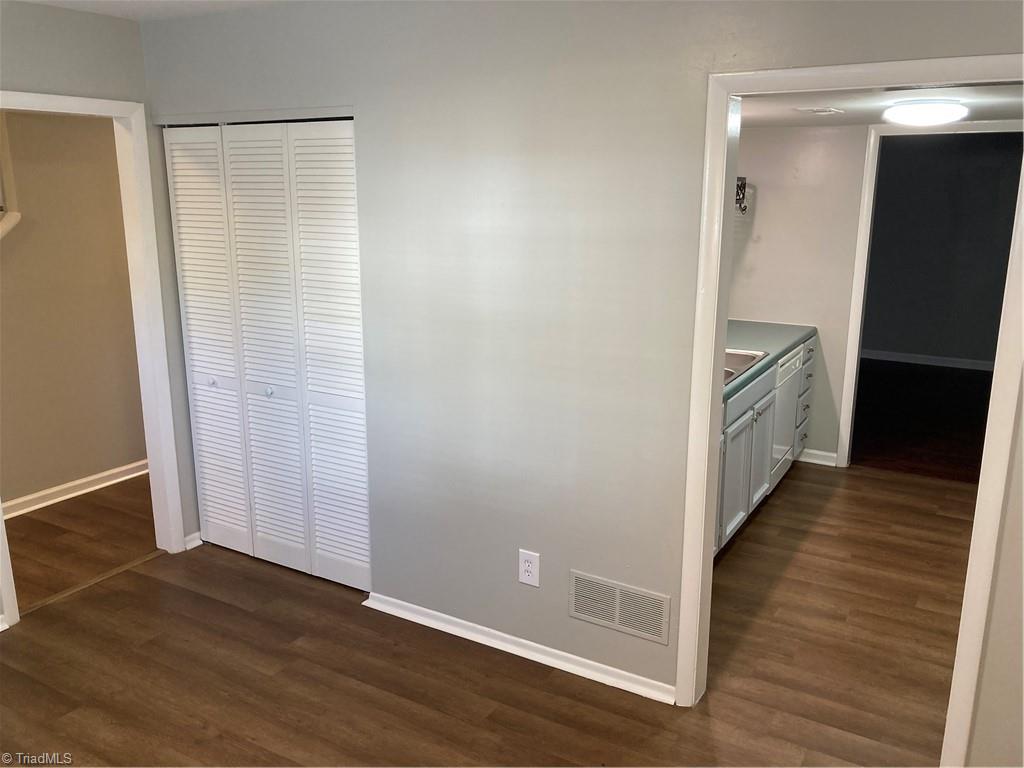 Rear FDR wall shows kitchen and a 3-pane cabinet which can be used as a pantry or for china.
