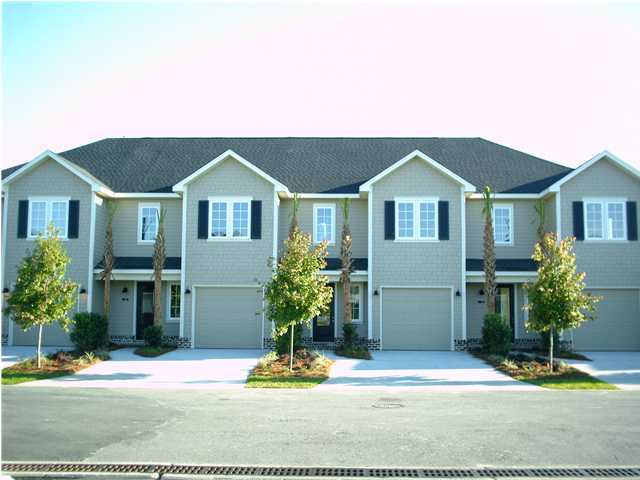 73 South Church Street, Unit 2 Santa Rosa Beach, FL 32459 - Photo 17 of 18 a front view of a house with a yard