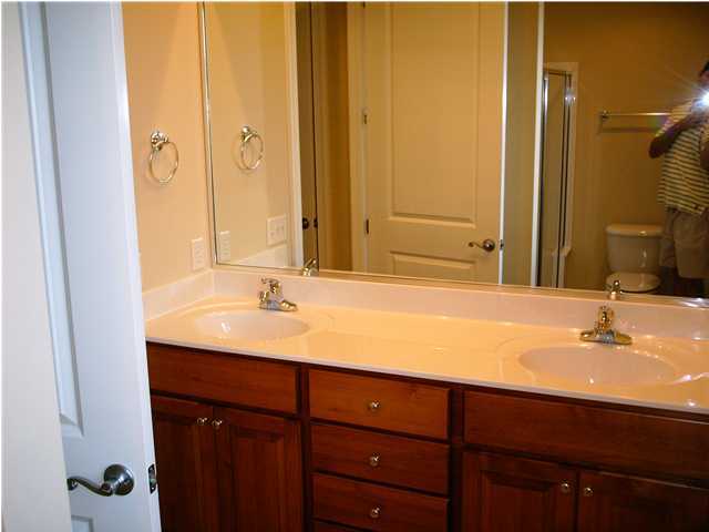 73 South Church Street, Unit 2 Santa Rosa Beach, FL 32459 - Photo 9 of 18 a bathroom with a double vanity sink and a mirror