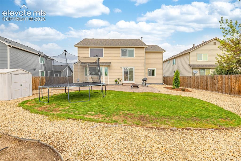 9127 Oakmont Road Peyton, CO 80831 - Photo 39 of 49 a swimming pool view with a outdoor seating