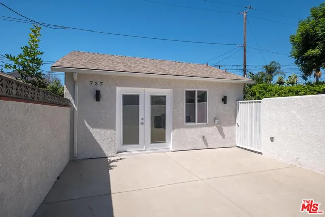 a view of a dining room kitchen with furniture and wooden floor