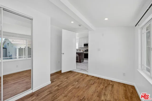 a view of a pathway with a house in the background
