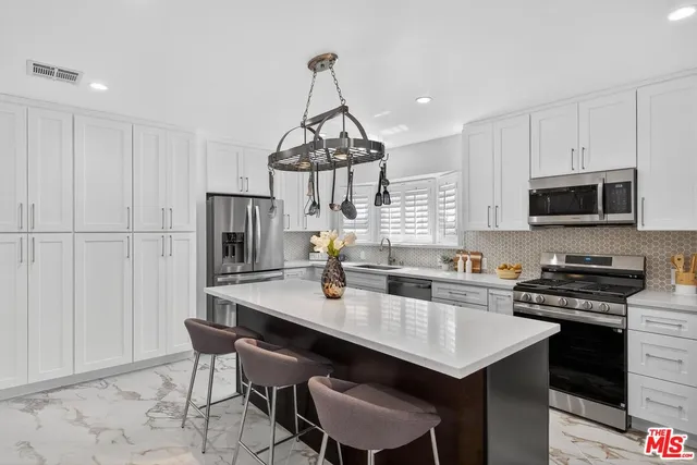 a bathroom with a sink and mirror