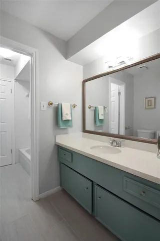 a bathroom with a shower and a bath tub