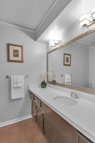 an empty room with wooden floor ceiling fan and windows