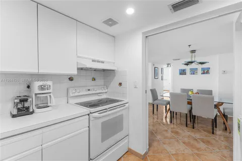 a white refrigerator freezer sitting in a kitchen