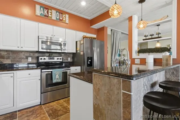 $479,000 | 131 Evergreen Condo Drive, Unit 1B, Sunrise Beach, MO 65079