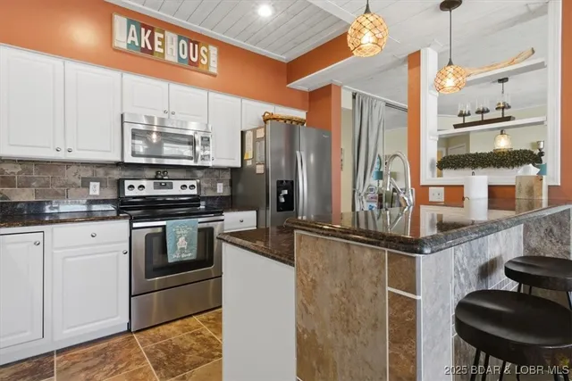 $479,000 | 131 Evergreen Condo Drive, Unit 1B, Sunrise Beach, MO 65079