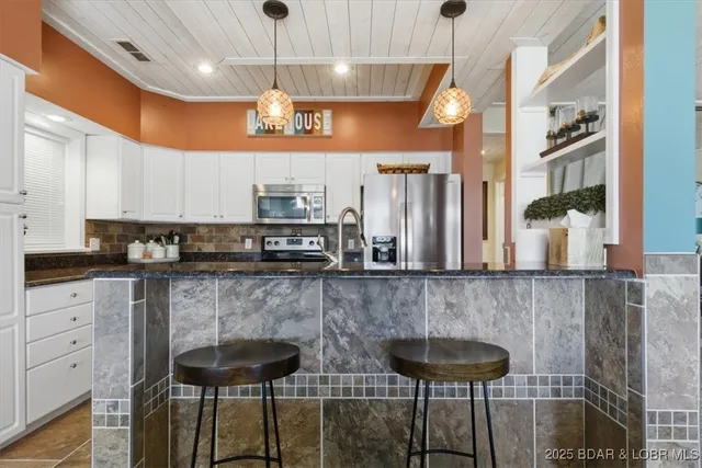 $479,000 | 131 Evergreen Condo Drive, Unit 1B, Sunrise Beach, MO 65079