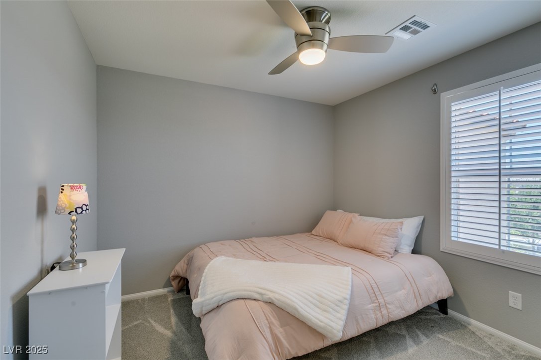 2870 Turnstone Ridge Street Henderson, NV 89044 - Photo 30 of 50 Carpeted bedroom featuring baseboards and ceiling fan