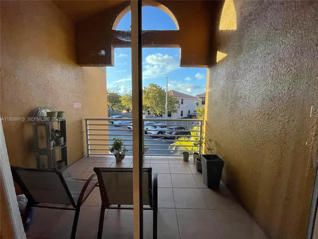 a view of a dining room with furniture and a window