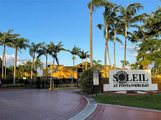 a sign board on the side of the road