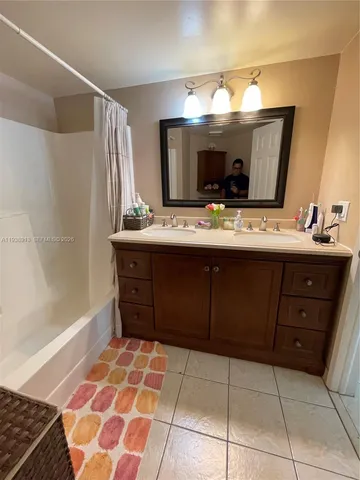 a view of walk in closet with clothes