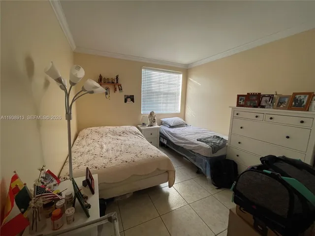 a bedroom with a bed and a walk in closet