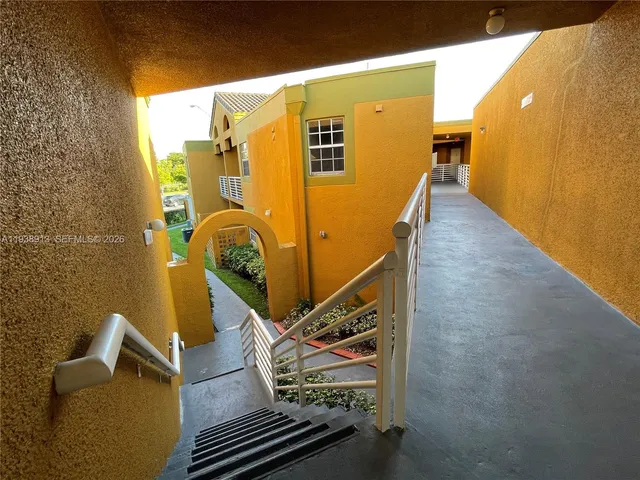 a front view of a house with yard and garage
