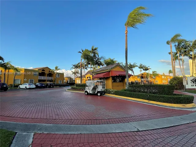 a view of a street with cars
