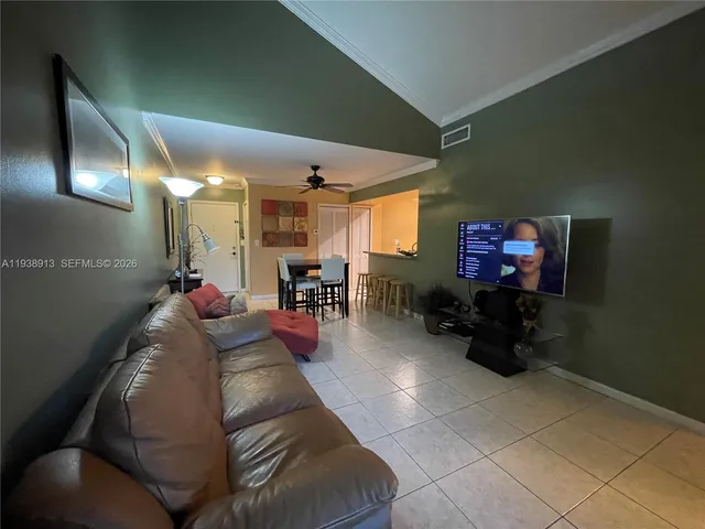 a kitchen with a sink refrigerator and microwave