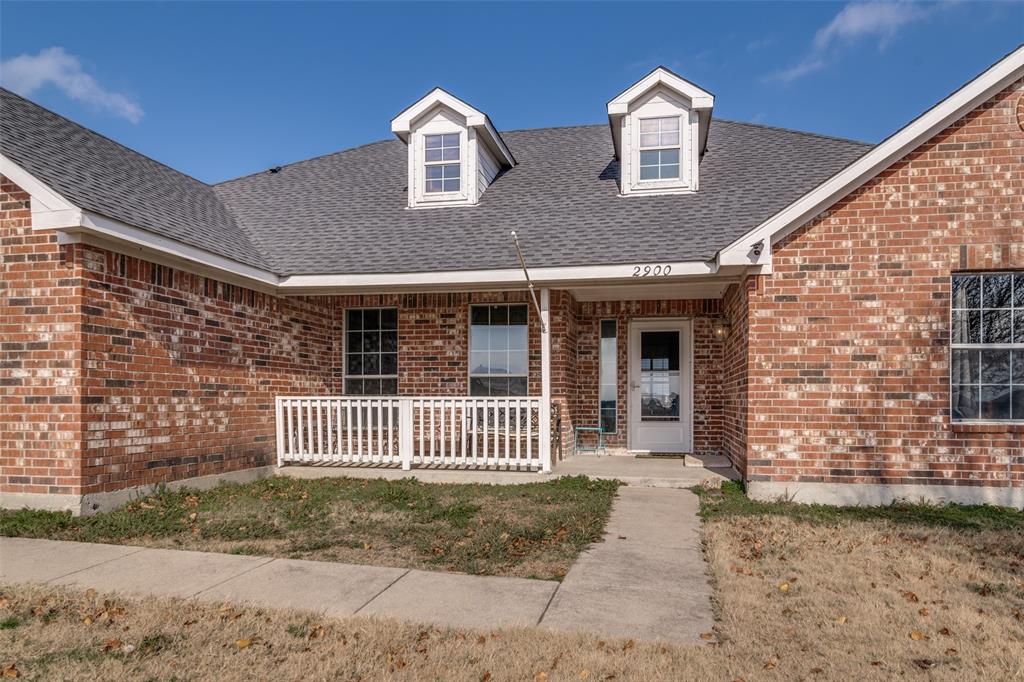 2900 County Road 643 Nevada, TX 75173 - Photo 2 of 36 a front view of a house with a garden