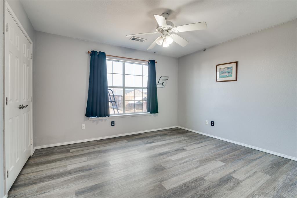 2900 County Road 643 Nevada, TX 75173 - Photo 23 of 36 an empty room with wooden floor and windows