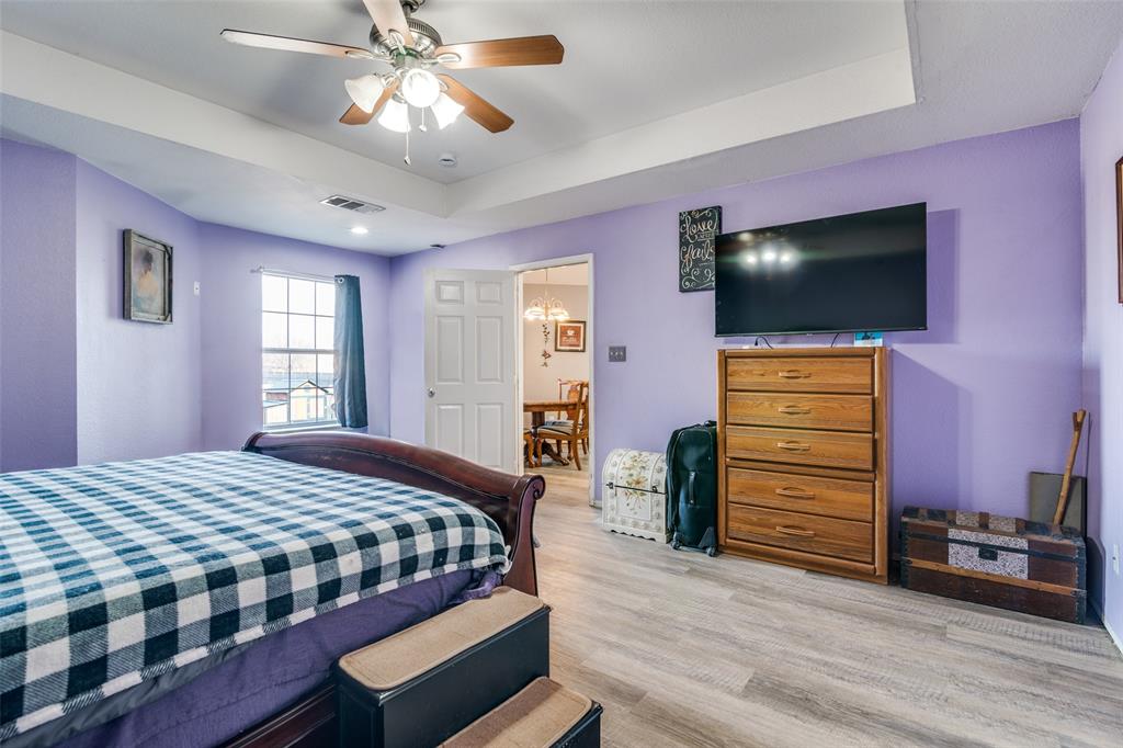 2900 County Road 643 Nevada, TX 75173 - Photo 28 of 36 a bedroom with a bed and a flat screen tv