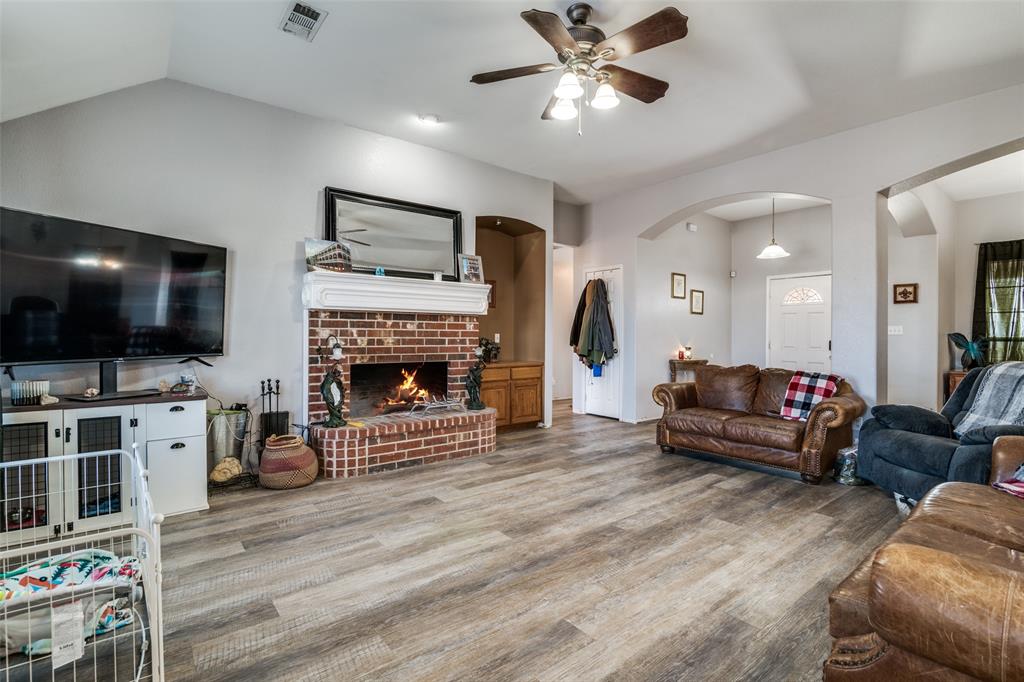 2900 County Road 643 Nevada, TX 75173 - Photo 6 of 36 a living room with furniture and a flat screen tv