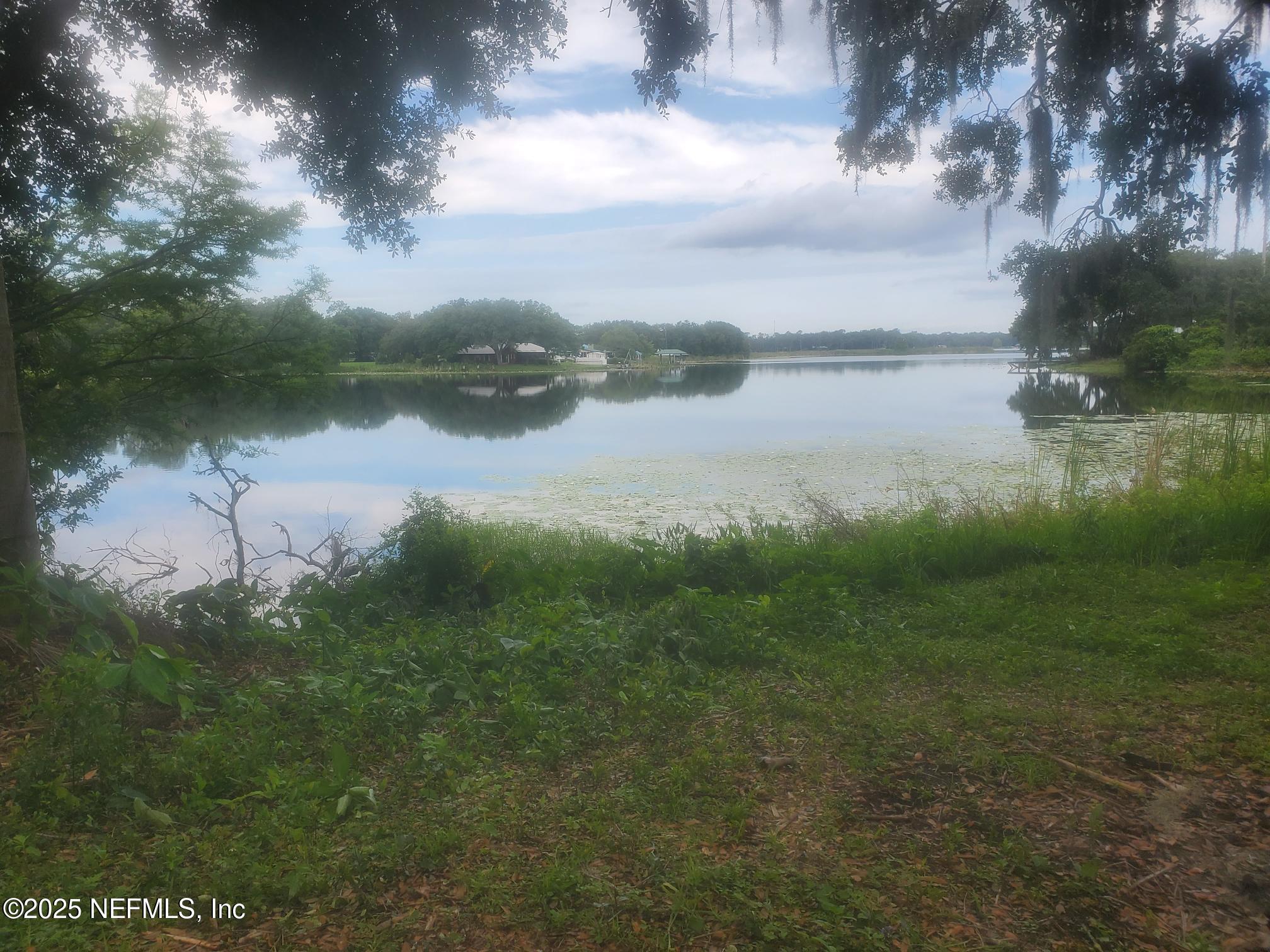 232 South Main Street Crescent City, FL 32112 - Photo 4 of 24 a view of a lake from a yard