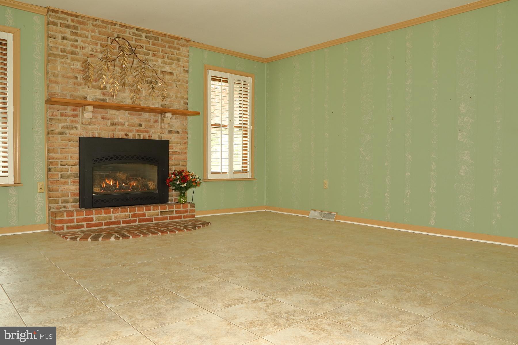 509 Koser Road Lititz, PA 17543 - Photo 21 of 36 a living room with a fireplace