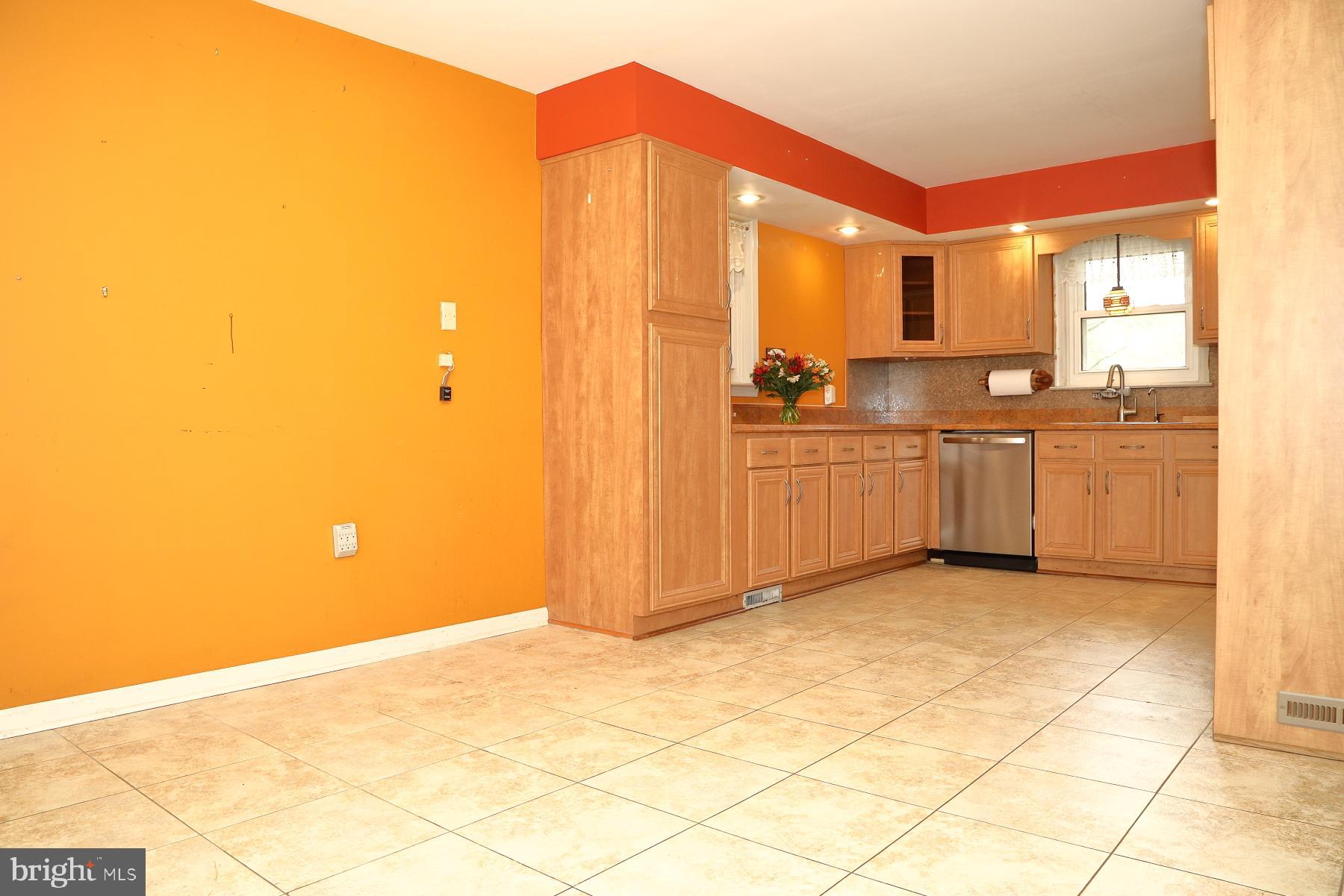 509 Koser Road Lititz, PA 17543 - Photo 30 of 36 a view of a kitchen with kitchen island granite countertop white cabinets and stainless steel appliances