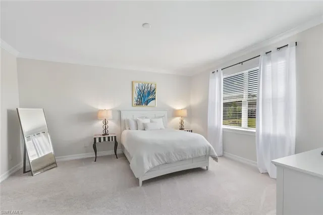 a large white kitchen with a large window