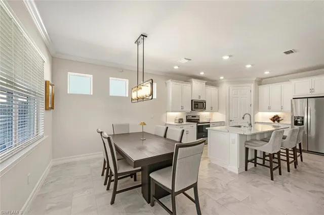 a view of a dining room with furniture