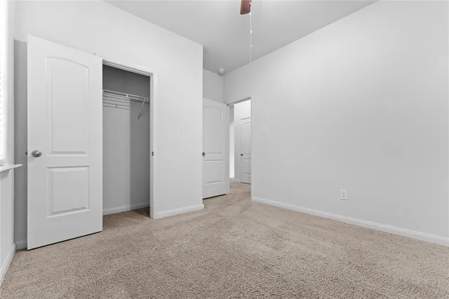 an empty room with closet area